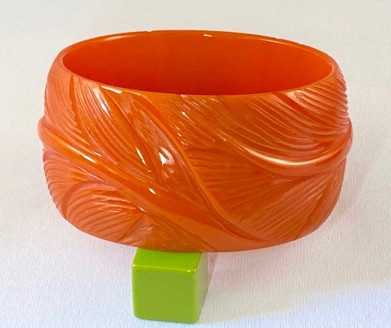 BB147 wide orange leaf carved bakelite bangle